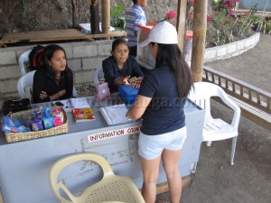 Lisa Paying at the Information Area