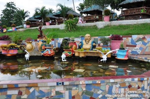 Fishpond with Buddha