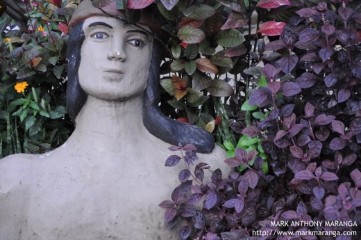 Statue hidden in the plants