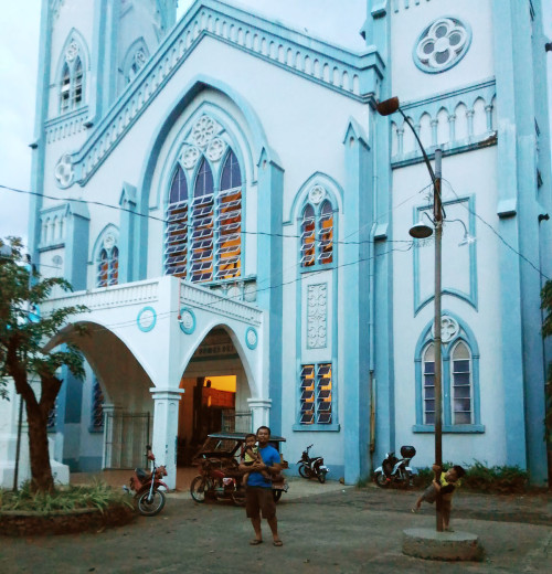 At the facade of the Palawan Cathedral