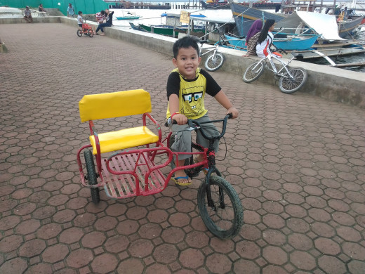 Sam driving a smaller bike