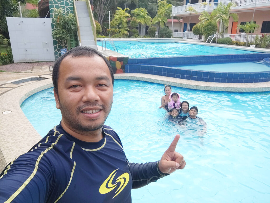 Family Picture at the Swimming Pool of North Sky Beach Resort