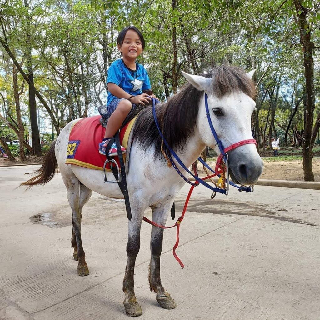 Jim riding a horse in Baguio