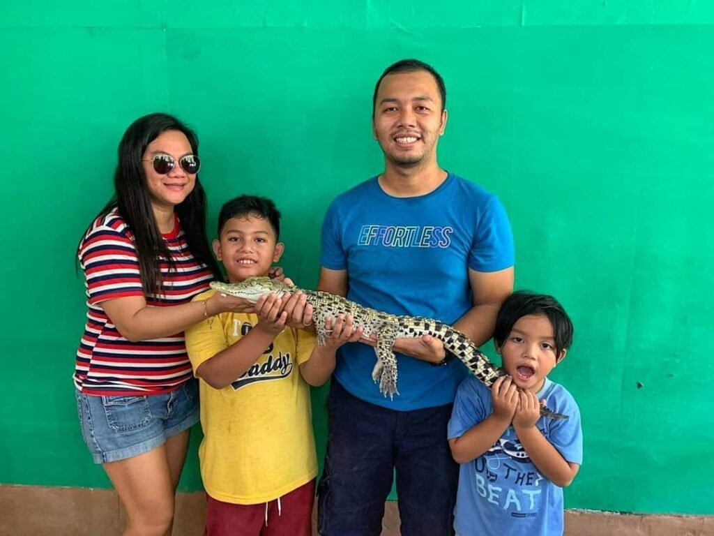 Holding a Live Crocodile in Davao